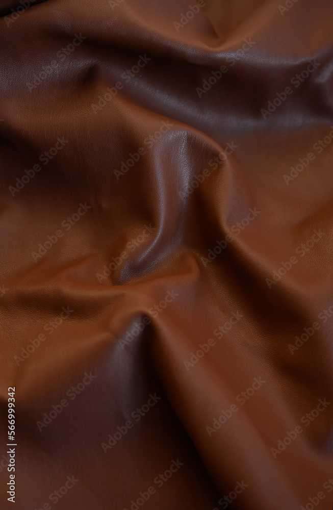 Naklejka premium brown eco leather. Artificial leather. Artificial leather. Leatherette background.