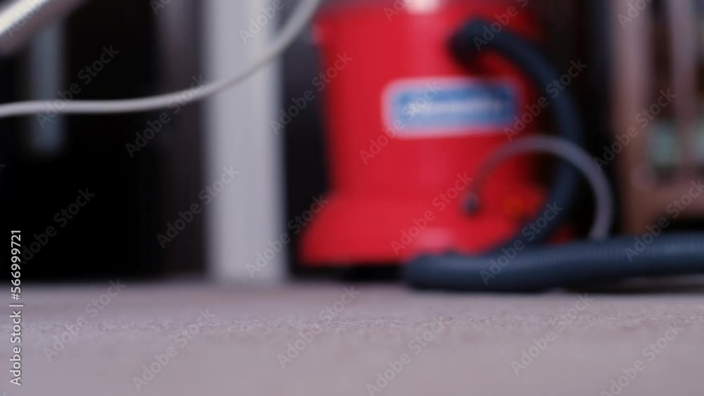Concept of professional cleaning in the apartment and office. Dry cleaning worker removing dirt from carpet Concept of professional cleaning in the apartment and office. Dry cleaning worker removing dirt from carpet