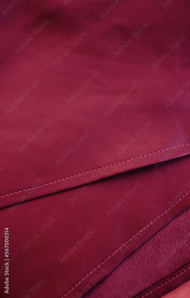 Artificial leather. Artificial leather. Leatherette background. Image toned in trendy pantone color of year 2023 Viva Magenta. Artificial leather. Artificial leather. Leatherette background. Image toned in trendy pantone color of year 2023 Viva Magenta.