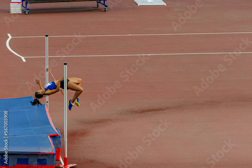 high jump female athlete in athletics event