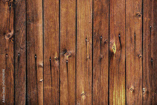 Wood texture. Wooden plank grain background. Striped timber desk closeup. Old table or floor. Brown boards.