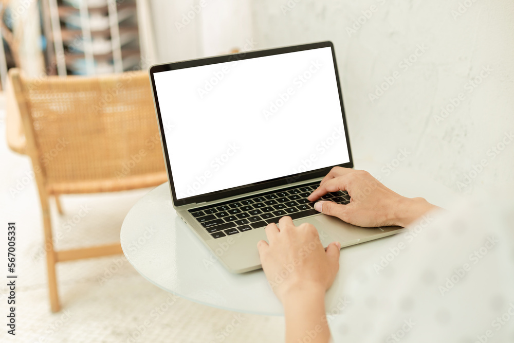 computer screen blank mockup.hand woman work using laptop with white background for advertising,contact business search information on desk at coffee shop.marketing and creative design computer screen blank mockup.hand woman work using laptop with white background for advertising,contact business search information on desk at coffee shop.marketing and creative design