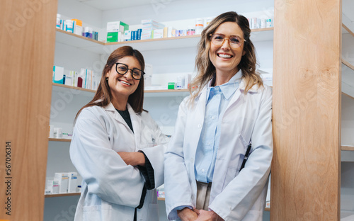 Konstfotografi Female pharmacists smiling at the camera in a chemist