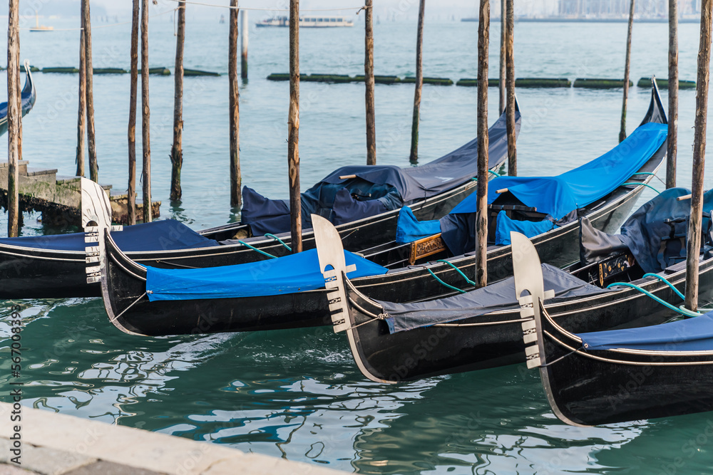 Gondolas docked by the lagoon in Venice, Italy