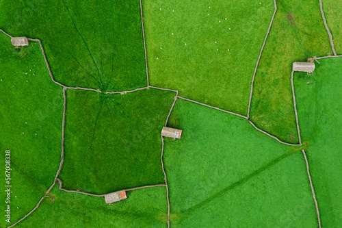 Drone ariel photos of the countryside and stone cottages in fields with stone wall borders