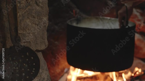 Traditional Cheesemaking Process Over Fire, Stirs in Pot, Chobareti Georgia photo