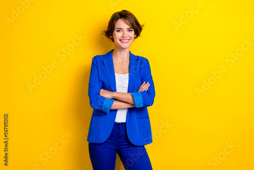 Photo cadre of young business lady crossed hands wear blue jacket ukraine concept confident person expert worker isolated on yellow color background