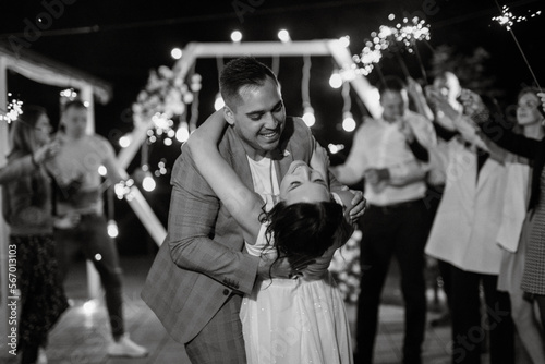 newlyweds at a wedding of sparklers