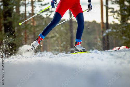Canvastavla male skier athlete goes uphill on cross-country skiing