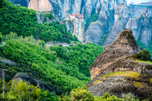 Obraz na płótnie A magical view with the spire of the hill in the holy complex in the famous valley of the Meteora rocks in Greece. Great amazing world. Attractions. w salonie