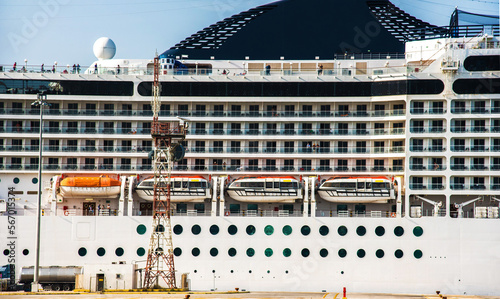 Obraz na płótnie The facade of a modern cruise ship with lifeboats. w salonie