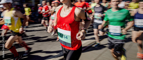 group runners running marathon in motion blur photo