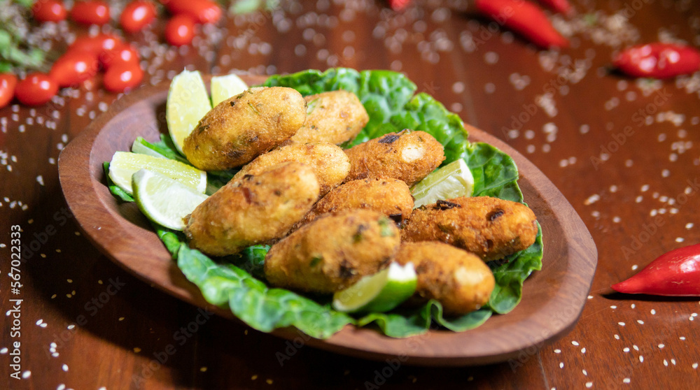 Fototapeta premium Fried ball of cod (bolinho de bacalhau)