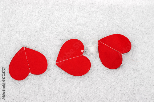 paper hearts harland red color isolated on snow ice background valentine day in love celebrate holiday mock up negative space for text sunshine gradient wide banner.some heart flat lay february 14th photo