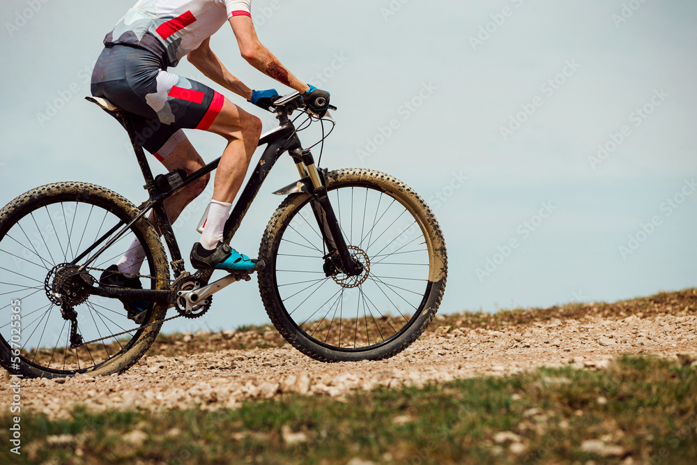 athlete cyclist riding mountain bike uphill athlete cyclist riding mountain bike uphill