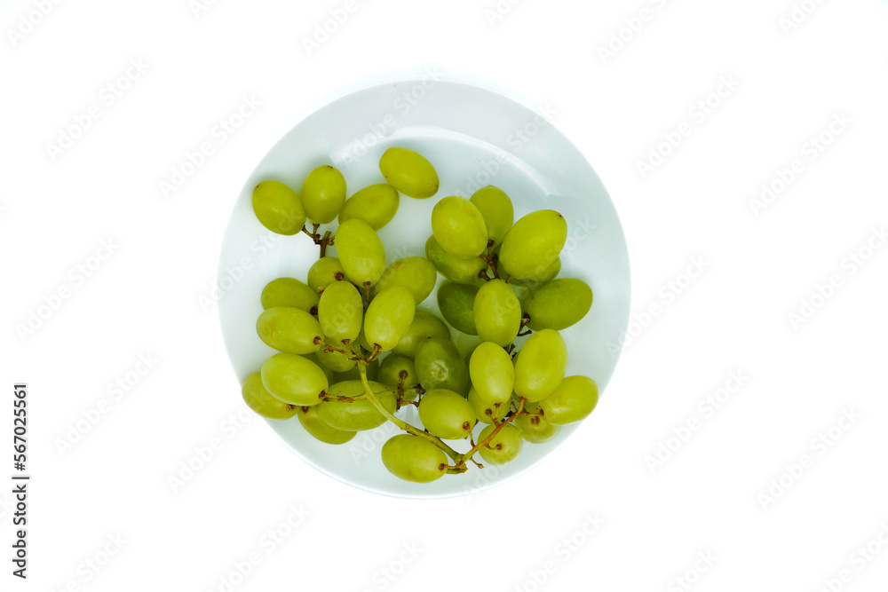 Green grapes isolated on white background. Top view or flat lay. Copy space. Green grapes isolated on white background. Top view or flat lay. Copy space.