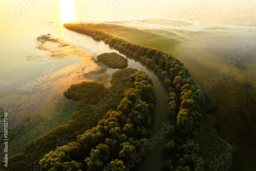 Sunrise in Danube Delta. Aerial view during a beautiful summer sunrise in Danube Delta landmark from Romania.