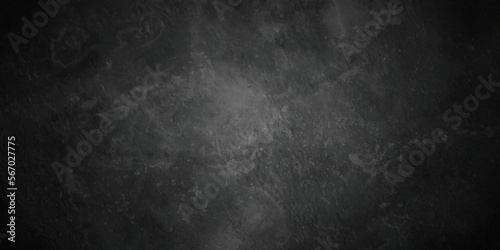 Dark black stone wall grunge backdrop texture background. monochrome slate grunge concrete wall black backdrop vintage marbled textured border background.	