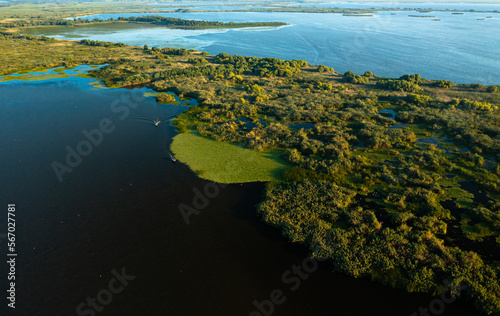 Danube Delta from above. Panoramic aerial view with the amazing Danube Delta landmark from Romania, nature landscapes with water and vegetation.