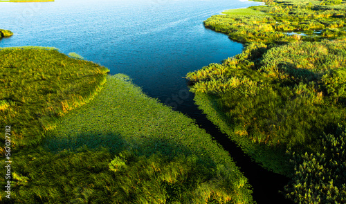 Danube Delta from above. Panoramic aerial view with the amazing Danube Delta landmark from Romania, nature landscapes with water and vegetation.