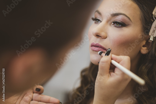 woman applying makeup