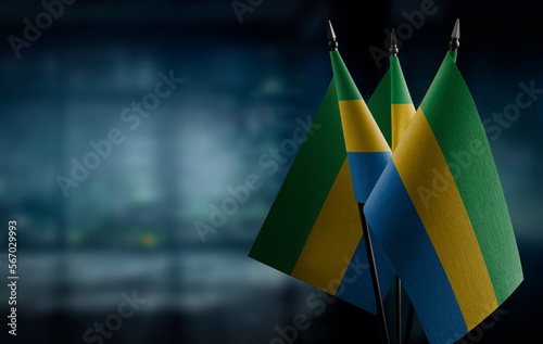 Small flags of the Gabon on an abstract blurry background photo