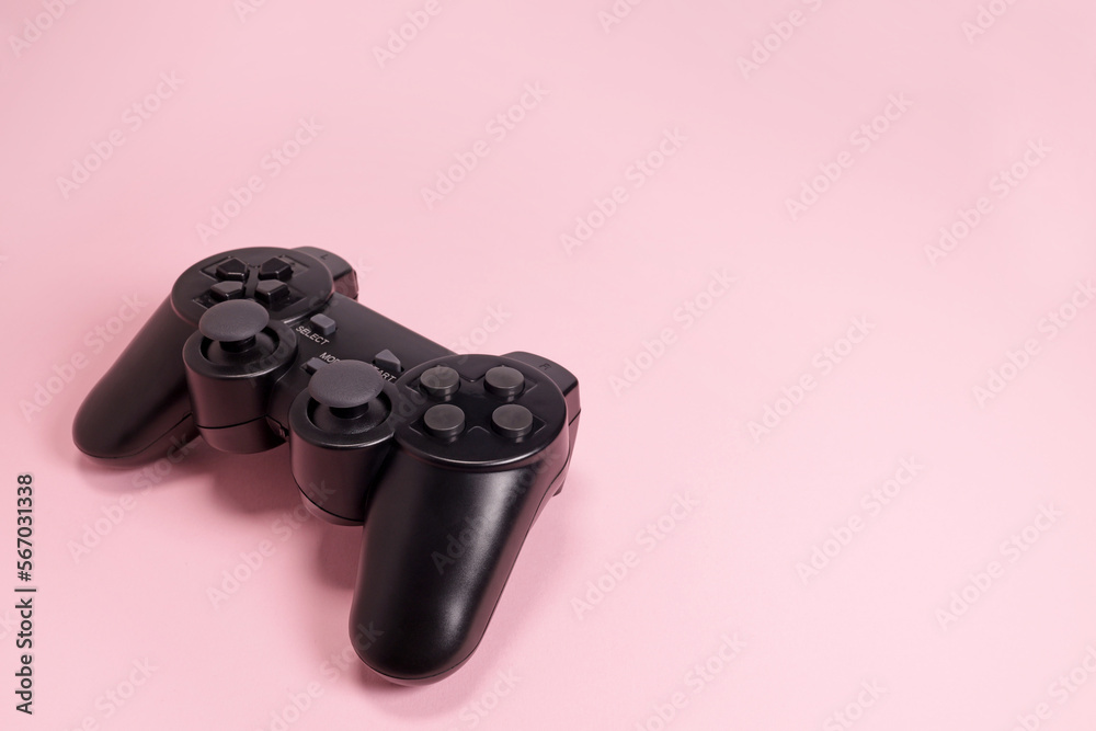Wireless modern joystick gamepad on pink background, video game concept. Copyspace for text Wireless modern joystick gamepad on pink background, video game concept. Copyspace for text