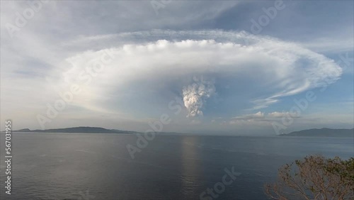 View of the volcanic eruption across the strait. Taal volcano eruption. Luzon Island, Philippines.