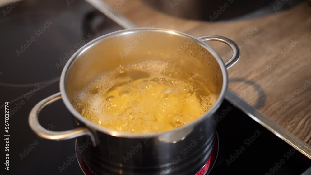 Overlooking potatoes which are cooked heavily in a small pot Overlooking potatoes which are cooked heavily in a small pot