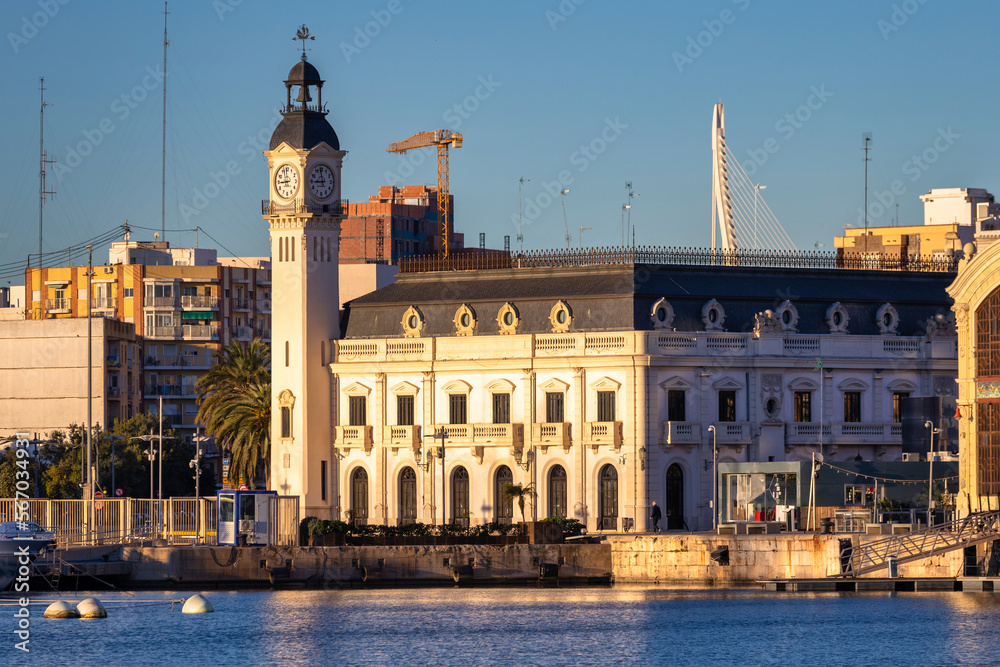 Landscape of the Port of Valencia with the clock tower at sunrise, Spain.