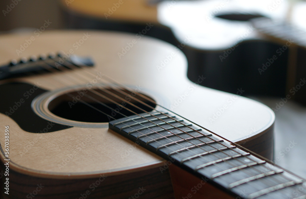 Fototapeta premium acoustic guitar, Used to play music and notes, for sing a song, macro abstract