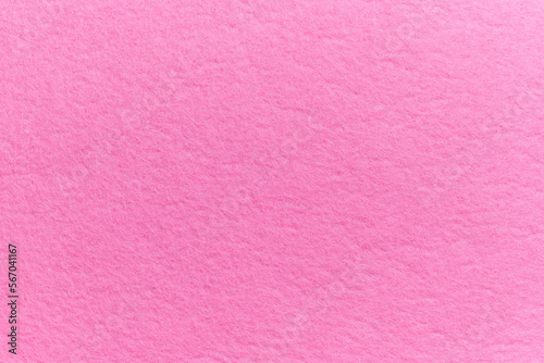 Soft felt textile material pink color, colorful texture flap fabric background closeup