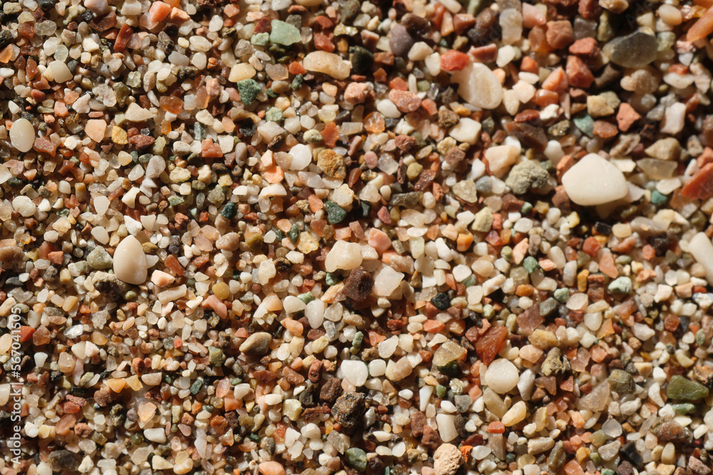 Closeup Macro shot of small yellow and brown grains of sand lying on the seashore on a bright sunny day Closeup Macro shot of small yellow and brown grains of sand lying on the seashore on a bright sunny day