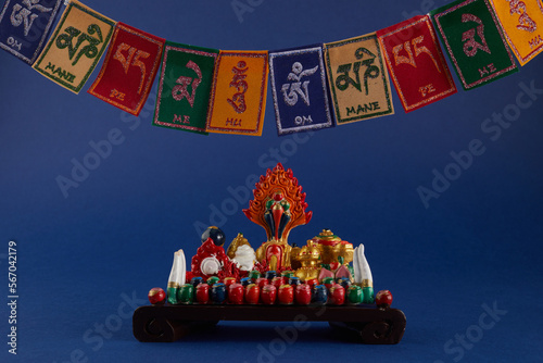 Happy Losar, Tibetan New Year background. Text on flags Om mani padme hum meaning The jewel is in the lotus photo