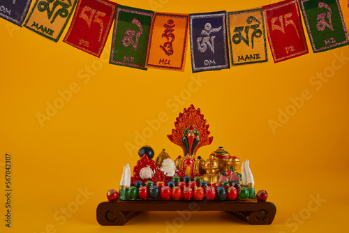 Happy Losar, Tibetan New Year background. Text on flags Om mani padme hum meaning The jewel is in the lotus photo