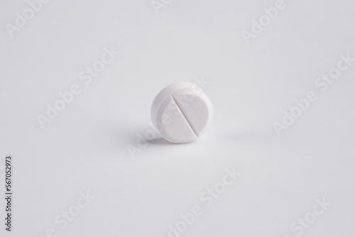 medicines  white pill on a light background  pill
