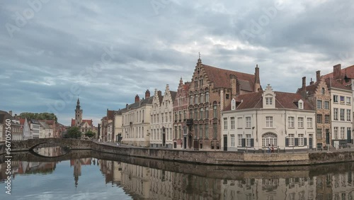 Bruges Belgium time lapse 4K, city skyline day to night timelapse at Spiegelrei Canal with King's Bridge (Koningsbrug) photo