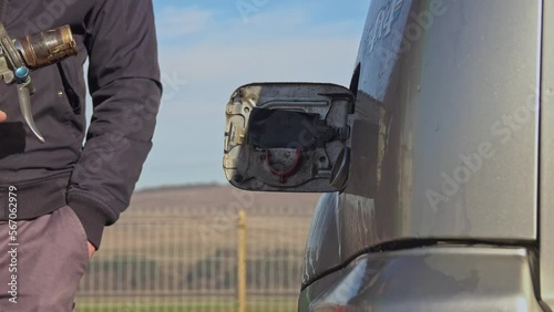 LPG filling of modern SUV car on a gas station