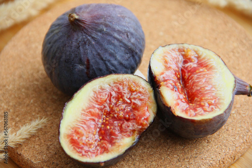 fresh figs cut on a wooden table