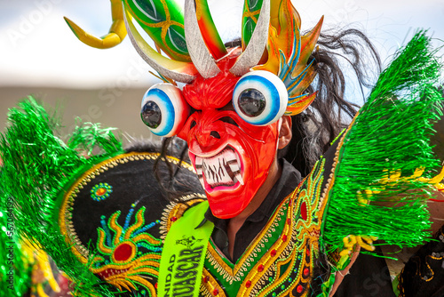 Dancers with typical devil costumes and other representations celebrate the festival of the Virgen de la Candelaria in Puno, Peru. photo