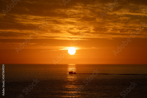 maine sunrise with fishing boat