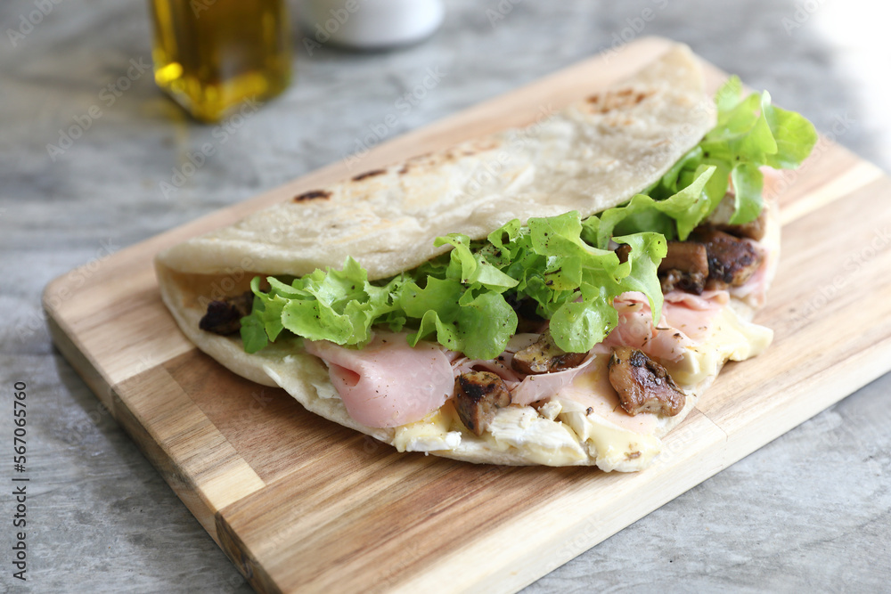 Italian cuisine , Piadina with Italian ham and cheese Italian cuisine , Piadina with Italian ham and cheese
