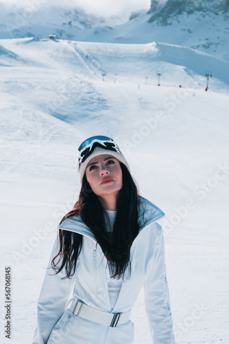 Woman skier posing on snow