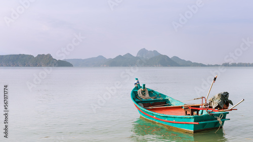 Little boat floating in the calm sea.