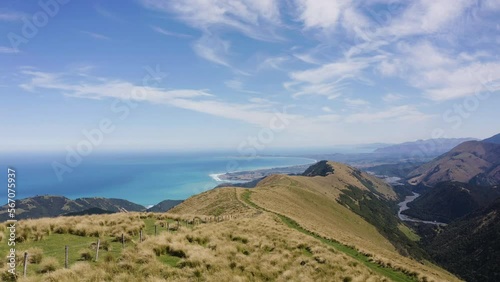 The Rolling Hills and Mountains of New Zealand overlook the stunning beaches in Kiakoura. photo