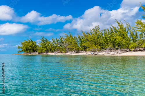 A view along the shore of a deserted bay on the island of Eleuthera, Bahamas on a bright sunny day