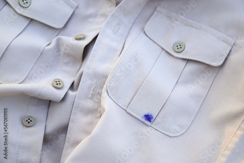 Dirty blue ink stain on bag shirt from using pen in daily life activity. dirty stains for cleaning concept.