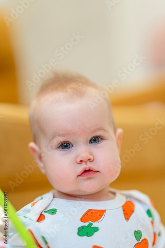 Portrait of a charming Caucasian baby at home