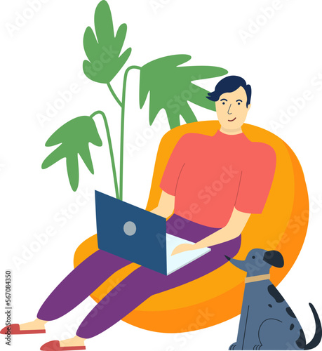 Smiling young man sitting in bean bag chair and working with notebook and his dog