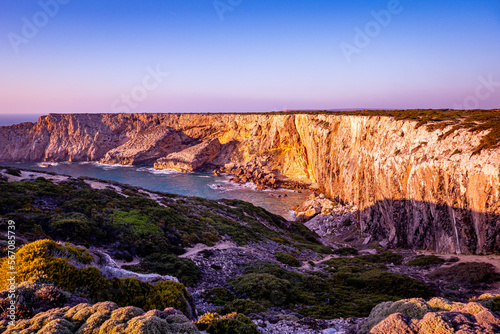 sunset on cliffs in algarve coast in southwestern portugal